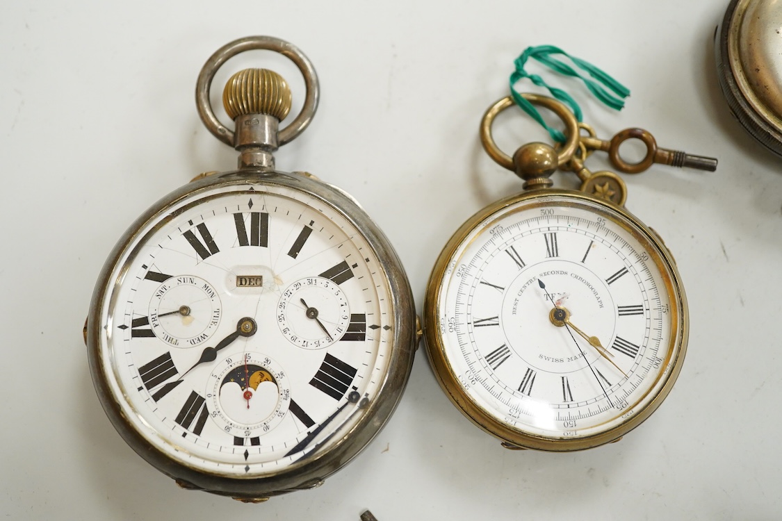 A George V silver cased goliath calendar moon phase open faced pocket watch, case diameter approx. 67mm(a.f.), together with five other pocket watches, including silver and white metal Waltham, a Camerer Cuss chrome case
